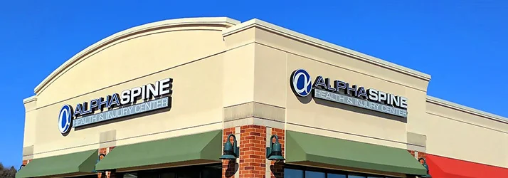 The sign above the door of the Alpha Spine Health & Injury Center clinic exterior
