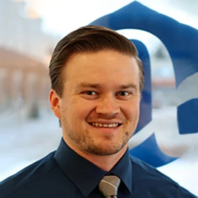 A headshot photo of Dr. Caleb Blank, a chiropractor at Alpha Spine Health & Injury Center